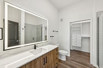 A bathroom with a white sink and a white toilet at The Hadley - North Port, FL Apartments, North Port, FL, 34287